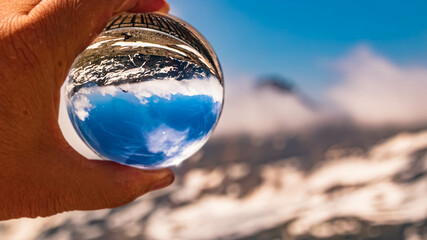 Crystal ball alpine landscape shot at the famous Moelltaler Gletscher, Flattach, Kaernten, Austria