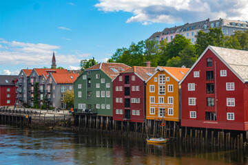 Fototapeta na wymiar Historical Old Timber Buildings (Norwegian: Gamle Bybro or Bybroa) over the river Nidelva in Trondheim