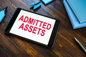 Info about admitted assets on the office desk.