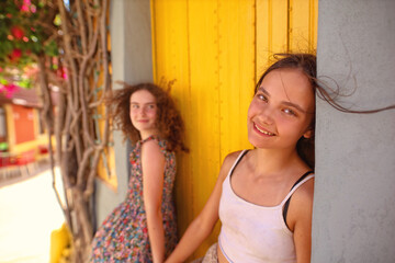 two young friends are walking and laughing