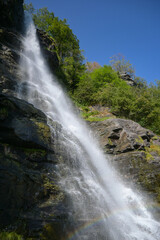 Vertical image of water falling from falls on the Norwegian mountains in Geiranger
