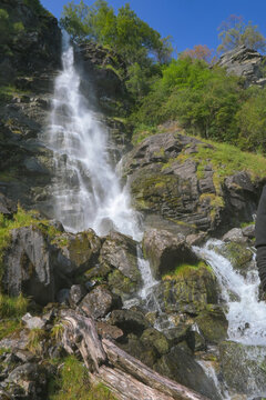 Vertical image of water falling from falls on the Norwegian mountains in Geiranger