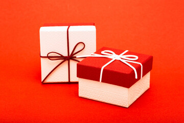Present. Gift boxes packed with red bow. Birthday or Christmas gifts and greetings