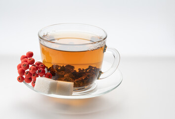 light ceylon leaf tea with rowan berry isolated on white, natural color