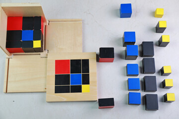 Montessori binomial and trinomial cubes