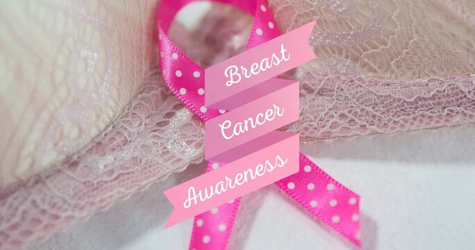 Animation of breast cancer awareness over pink ribbon and bra