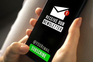 Woman holding mobile phone with newsletter signup page close-up. Register a new member concept photo close-up. Subscribe button