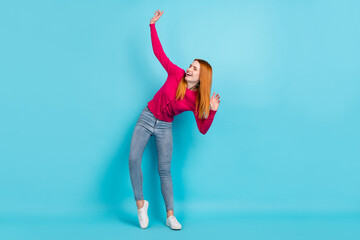 Full length body size view of attractive girlish cheerful girl dancing moving having fun isolated over vivid blue color background
