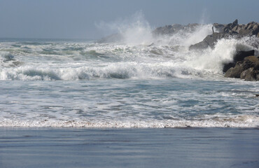 waves crashing on rocks