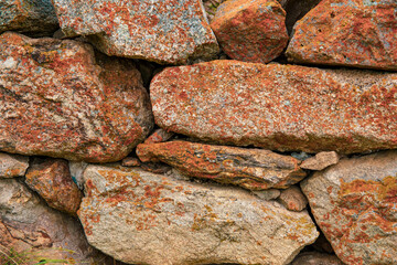 A wall of large rough-hewn rocks