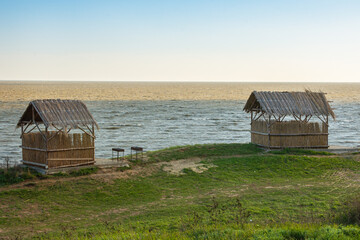 Two straw houses on the seashore
