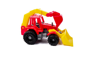 Obraz na płótnie Canvas children's toy made of plastic red tractor isolated on a white background