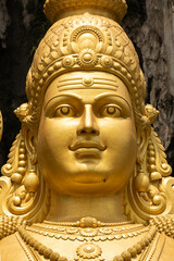 Closeup of the huge statue Sri Muruga, the Hindu god of war, near the Batu Caves, in the Gombak District, Selangor, Malaysia