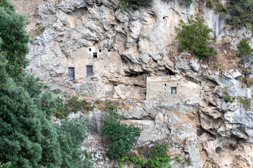 remains of an old stables carved out of the rocks on the path of the gods (sentiero degli dei) on...