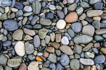 Abstract pebble background. Pebble texture on the Black Sea beach