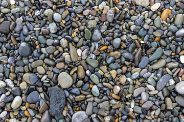 Abstract pebble background. Pebble texture on the Black Sea beach