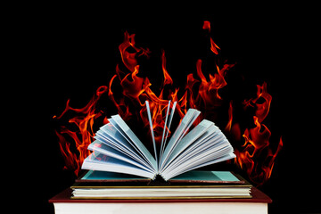The book was opened with a burning flame. book fire