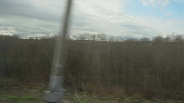 View of outside landscape, shot from running Super fast bullet train from Moscow to St. Petersburg.