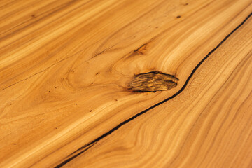 Style wooden countertop slab, saw cut wood treated with varnish close-up on black. Isolate.
