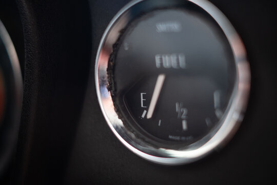 Old fashioned white needle Petrol gauge on empty 