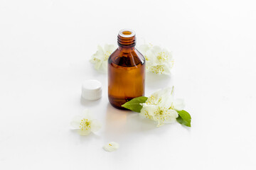 Bottle of fragrant jasmine essential oil. Close up
