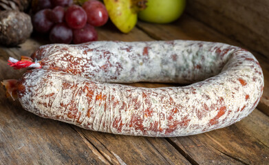 Whole piece of salchichón, with natural casing skin. Spanish sausage. 