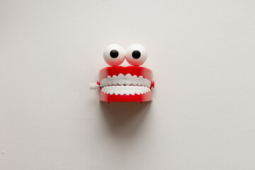 Eyes and teeth toy on white background