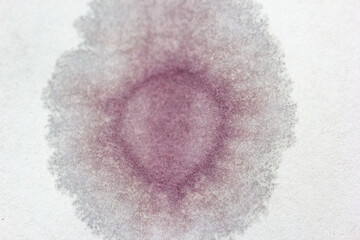 wine stain on white sheet. graphic resource. conceptual, nuances