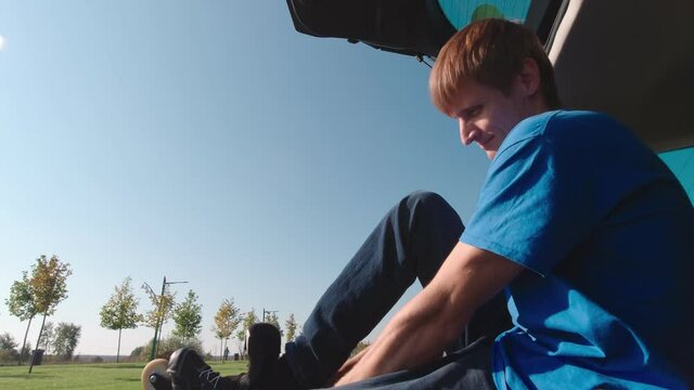 Man puts on roller skates slow motion
