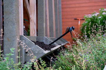 The making of a vertical wall garden with blocks made of waste plastics on behalf of climate...