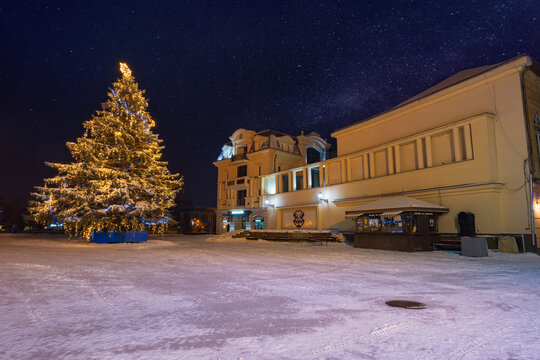 zhgorod, ukraine - JAN 06, 2019: winter holidays in the old town. christmas tree in downtown. beautiful scenery at night
