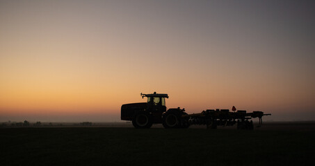 Fototapeta premium tractor at sunset