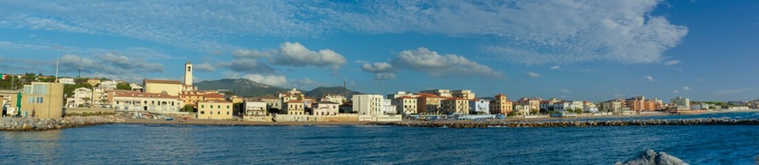 Panorama of the city of San Vincenzo, seen from the sea. Blue sky and clouds. Livorno, Tuscany,...