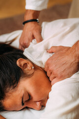 Obraz na płótnie Canvas Shiatsu Arms and Shoulder Massage. Therapist Massaging the Small and Large Intestine Meridians.