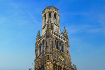 Fototapeta na wymiar Belfry of Bruges, medieval bell tower in the centre of Bruges, Belgium 