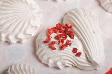 Homemade marshmallows of various shapes and colors are laid out on trays. Stabilization of Zephyr before packaging.