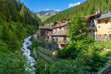 Fototapeta na wymiar Idyllic sight in the beautiful village of Saint Rhemy en Bosses, in the Great St Bernard Valley. Aosta Valley, Italy.