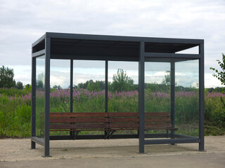 bus stop pavilion in the village with a bench without an urn