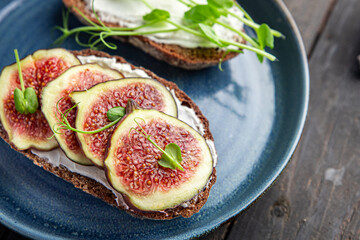 fig sandwich breakfast healthy diet fresh meal snack on the table copy space food background rustic. top view veggie vegan or vegetarian food