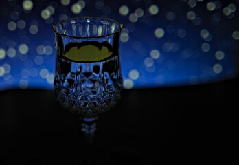 glass of water in the blue light