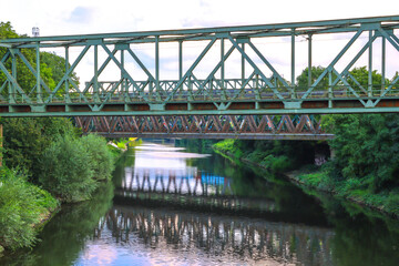 Fototapeta na wymiar bridge over river in the park