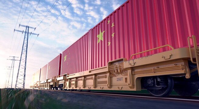 Chinese exports. Freight train with loaded containers in motion. 
