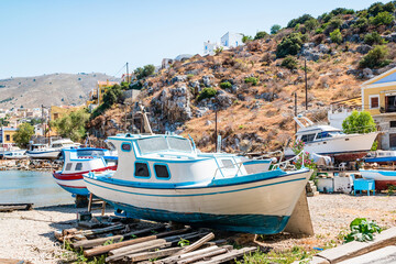 Fototapeta na wymiar Fishing boats on land on Symi Island near Rhodes, Greece
