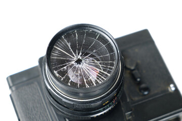 Bbroken lens on the old vintage film camera body, closeup
