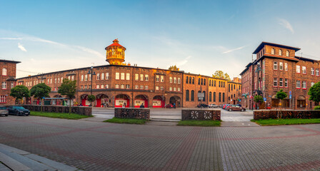 Katowice, Silesia, Poland; September 29, 2021: View on central square (plac Wyzwolenia) in historical district Nikiszowiec in the morning light. Old, brick buildings.