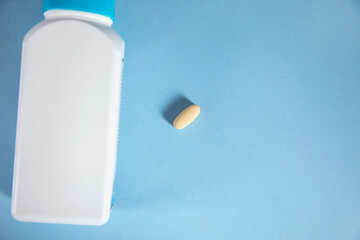 drug and bottle on table