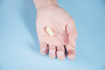 woman holding drug on table