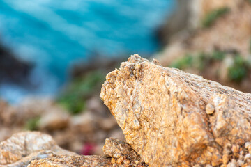 Close up of a small rock in the cliff.