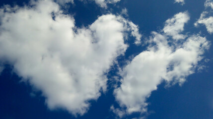 A heart-shaped cloud. A figure of clouds in the sky. valentine's day. A fluffy cumulus cloud looks like a heart. The symbol of Valentine's Day