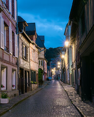 Fototapeta na wymiar Picturesque street of old town Honfleur, a french commune in the Calvados department and famous tourist resort in Normandy. Especially known for its old port.